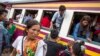 Cambodian workers get off a train as they prepare to migrate back to Cambodia at Aranyaprathet train station in Sa Kaew, June 15, 2014.