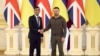 In this photo provided by Ukraine's Presidential Press Office, Ukrainian President Volodymyr Zelenskyy, right, shakes hands with British Prime Minister Rishi Sunak during their meeting in Kyiv, Ukraine, Nov. 19, 2022.