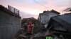 Rescuers search for survivors amid ruins of houses damaged by an earthquake in Cianjur, West Java, Indonesia, Nov. 21, 2022. 
