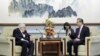 In this photo released by China's Ministry of Foreign Affairs, former Secretary of State Henry Kissinger, left, meets with Chinese State Councilor Wang Yi in Beijing, Wednesday, July 19, 2023. 