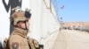 FILE - Bagian tembok beton perbatasan, di sepanjang perbatasan dengan Suriah di kawasan al-Baghouz Irak, pada hari peresmiannya, 28 Januari 2024. (Foto oleh KEMENTERIAN DALAM NEGERI IRAK / AFP)