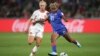 Haiti's Ruthny Mathurin kicks the ball ahead of Denmark's Pernille Harder during a Women's World Cup match in Perth, Australia, Aug. 1, 2023.