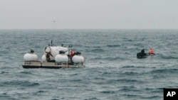 FILE - In this image released by Action Aviation, the submersible Titan is prepared for a dive into a remote area of the Atlantic Ocean on an expedition to the Titanic on June 18, 2023.
