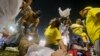 Rescuers attend an injured fan lying on the field of the Cuscatlan stadium in San Salvador, El Salvador, May 20, 2023. 