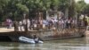 Selon le journal Al-Ahram, qui a été le premier à faire état de l'accident, le minibus est tombé d'un ferry traversant le fleuve, le conducteur du bus n'ayant pas tiré le frein à main. 