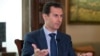 In this Sept. 21, 2016, photo released by the Syrian Presidency, Syrian President Bashar al-Assad speaks to The Associated Press at the presidential palace in Damascus, Syria.