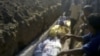This image made from amateur video on July 13, 2012 purports to show a funeral for victims killed by violence that, according to anti-regime activists, was carried out by government forces in Tremseh, Syria.