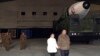 This photo provided on Nov. 19, 2022, by the North Korean government shows North Korean leader Kim Jong Un and his daughter inspecting a missile at Pyongyang International Airport in Pyongyang, North Korea, Nov. 18, 2022. 