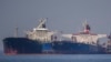 The Liberian-flagged oil tanker Ice Energy (L) transfers crude oil from the Russian-flagged oil tanker Lana (R) (former Pegas), off the shore of Karystos, on the Island of Evia, May 29, 2022.
