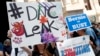 Demonstrators make their way around downtown Philadelphia, July 25, 2016, during the first day of the Democratic National Convention.
