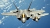 FILE - Two U.S. Air Force F-22 Raptor stealth jets are seen flying in formation in a handout photo dated Aug. 4, 2010. 