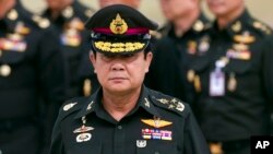 FILE - New Thai Prime Minister Prayuth Chan–ocha arrives to attend an establishment anniversary of the 21st Infantry Regiment, Queen's Guard in Chonburi Province, Thailand, Aug. 21, 2014. 