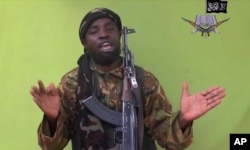 FILE - This image taken from video by Nigeria's Boko Haram in May 2014 shows Abubakar Shekau.