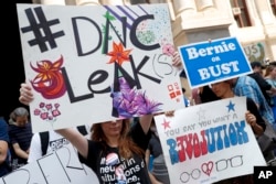 Demonstrators make their way around downtown, July 25, 2016, in Philadelphia, during the first day of the Democratic National Convention after some of the 19,000 emails, presumably stolen from the DNC by hackers, were posted to the website Wikileaks.
