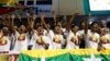 Myanmar fans cheer as they watch Kempo competition during the 27th SEA Game at Thuwunna stadium Friday, Dec.20, 2013, in Yangon, Myanmar. (AP Photo/Khin Maung Win) 