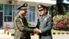 General Pol Saroeun, commander-in-chief of the Royal Cambodian Armed Forces, left, shakes hands with General Thanchaiyan Srisuwa, chief of defense forces of the Royal Thai Armed Forces, right, in Phnom Penh, Cambodia, June 22, 2018. (Courtesy of Gen. Pol Saroeun's Facebook page) 