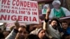 FILE - Kashmiri Shi’ite Muslims shout slogans against the Nigerian government after the army killed 348 members of a Shi'ite minority sect and detained the group’s leader during an altercation there in December, in Srinagar, Indian-controlled Kashmir, Dec. 18, 2015.