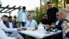 Guests from places within Denmark and Northern Europe sit together at the engagement party of a resident in Mjolnerparken, a housing estate on the Danish government's "Ghetto List," in Copenhagen, Denmark, May 6, 2018.