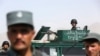 FILE - Peace talks between Afghans and the Taliban allegedly will resume soon. Here, Afghan security forces inspect a suicide attack site after clashes with Taliban fighters at an intelligence facility in Kabul, July 7, 2015.