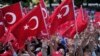 Pro-government demonstrators wave Turkish flags as they protest against the attempted coup in Istanbul, Turkey, July 19, 2016. The Turkish government accelerated its crackdown on alleged plotters of the failed coup against President Recep Tayyip Erdogan.