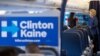 Hillary Clinton speaks with senior aide Huma Abedin (L) aboard her campaign plane at an airport in White Plains, New York, Oct. 28, 2016. The FBI found the potentially incriminating emails on a computer Abedin shared with her estranged husband.