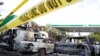 A gas station is seen burned down after disturbances following the police shooting of a man in Milwaukee, Wisconsin, Aug. 14, 2016. 