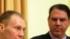 U.S. Army Specialist Mathew Justice (l) and Florida Representative Alan Grayson