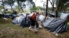 Venezuelan migrants camp in a park near the main bus terminal in Bogota, Colombia, Sept. 7, 2018.