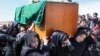Afghan women's rights activists carry the coffin of 27-year-old Farkhunda, who was beaten to death by a mob, during her funeral in Kabul, March 22, 2015.