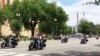 Participants in the Rolling Thunder annual motorcycle rally ride past the National Museum of the American Indian during the parade ahead of Memorial Day in Washington, May 29, 2016. (S. Verma/VOA)