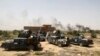 Smoke rises from Islamic State positions as Iraqi federal police take combat positions at the front line during fight against IS outside Fallujah, May 28, 2016. 