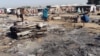 A general view shows the damage at a camp for displaced people after an attack by suspected members of the Islamist Boko Haram insurgency in Dalori, in northeast Nigeria, Nov. 1, 2018. 