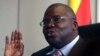 FILE: Zimbabwe's new finance minister Tendai Biti talks at a news conference in Harare Wednesday Feb. 18, 2009. Biti, now in charge of the country's finances said he had started paying civil servants in U.S. dollars, pledging to get a country crippled by