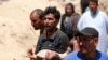 Displaced Iraqis fleeing Ramadi cross the Bzebiz bridge after spending the night walking toward Baghdad, as they flee their hometown, May 16, 2015. Islamic State militants seized the center of Ramadi, in western Iraq. 