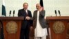 Afghan President Ashraf Ghani, right, shakes hands with Pakistani Prime Minster Nawaz Sharif during a joint press conference at the presidential palace in Kabul, May 12, 2015. 