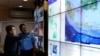 Indonesia's vice-president Jusuf Kalla (L) monitors progress in the search for AirAsia Flight QZ8501 during a visit to the National Search and Rescue Agency in Jakarta, December 28, 2014.