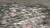 FILE - An aerial view shows burned down villages once inhabited by the Rohingya seen from the Myanmar military helicopters that carried the U.N. envoys to northern Rakhine state, Myanmar, May 1, 2018.
