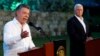Shugaban Colombia Juan Manuel Santos, (hagu) yana magana da manema labarai yayin da mataimakin shugaban Amurka Mike Pence (dama) yake sauraro a wani taron manema labarai na hadin gwiwa da suka yi a ranar 13 ga watan Agusta, 2017.