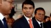 Madagascar's transitional leader Andry Rajoelina (C) attends a ceremony at Antananarivo's Town Hall to commemorate the students' unrest in 1972 which led to the first Republic's fall, May 13, 2013. 