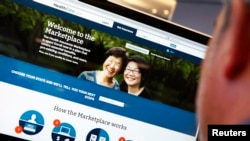FILE - A man looks over the Affordable Care Act (commonly known as Obamacare) signup page on the HealthCare.gov website in New York. 