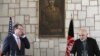 U.S. Defense Secretary Ash Carter, left, listens to remarks by Afghan President Ashraf Ghani during a news conference at the Presidential Palace in Kabul, Feb. 21, 2015. 