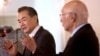 Chinese Foreign Minister Wang Yi, left, speaks during a meeting with Pakistan's Prime Minister's Adviser on Foreign Affairs Sartaj Aziz, in Islamabad, Pakistan, Feb. 12, 2015.