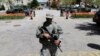 A National Guardsman stands outside the City Hall in Baltimore, April 29, 2015. 