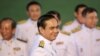 FILE - Thailand's Prime Minister Prayuth Chan-ocha and his cabinet complete a photo session after meeting with King Bhumibol Adulyadej in Bangkok.