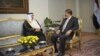 In this photo released by the Egyptian Presidency, Saudi Arabia's ambassador to Egypt Ahmed Kattan meets with Egyptian President Mohammed Morsi, in Cairo, July 7, 2012.
