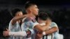Messi, riga mai lamba 10, da abokanan wasansa suna murnar kwallonsa ta uku 