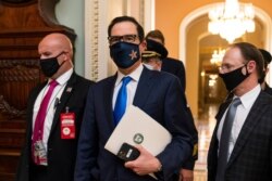 FILE - Treasury Secretary Steven Mnuchin makes a brief comment as he leaves the Capitol, Sept. 30, 2020, in Washington.