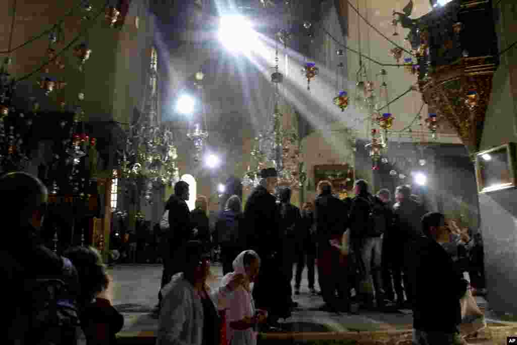 Christian worshipers visit the Church of Nativity, traditionally believed by Christians to be the birthplace of Jesus Christ, ahead of Christmas, in the West Bank town of Bethlehem, December 23, 2012.