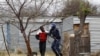 A man is arrested by police at Lonmin's Marikana mine in South Africa's North West Province, September 15, 2012. 