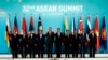 Leaders and country representatives from left to right; Malaysia's Former Deputy Prime Minister Tun Musa Hitam, Myanmar President Win Myint, Philippine President Rodrigo Duterte, Vietnam's Prime Minister Nguyen Xuan Phuc, Singapore's Prime Minister Lee Hsien Loong, Thailand's Prime Minister Prayuth Chan-ocha, Brunei's Sultan Hassanal Bolkiah, Cambodia's Prime Minister Hun Sen, Indonesia's President Joko Widodo, and Laos Prime Minister Thongloun Sisoulith, pose for a group photo during the opening ceremony of the 32nd ASEAN Summit on Saturday, April 28, 2018, in Singapore. (AP Photo/Yong Teck Lim)